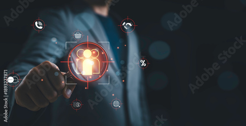 Foto Businessman using magnifying glass to identify customers representing Customer Relation Management or CRM marketing strategy, client segmentation and Customer targeting audience analysis concept