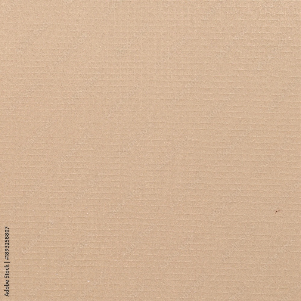 Fototapeta premium a slightly worn brown cardboard box on a table, with crumpled white packing paper resting loosely on top