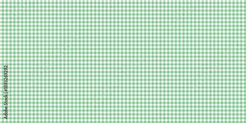 Green gingham checkerboard pattern background. Classic checkered plaid texture for picnic blankets, tablecloths, fabric prints, and spring-themed graphic design backdrops.