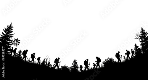 Silhouette of hikers walking on a grassy hill with trees.