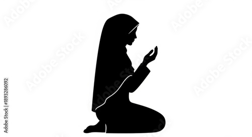 Woman in hijab kneeling and praying in silhouette with hands raised in devotion and spirituality