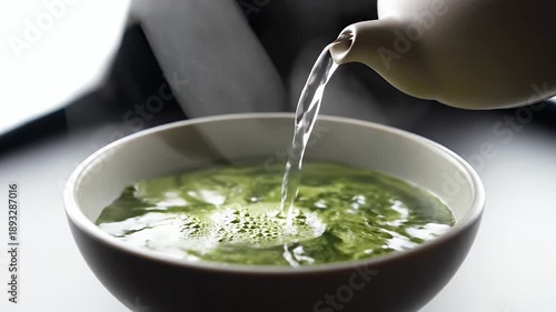 Ceremonial Matcha Tea Preparation Hot Water Poured Into Vibrant Green Powder In A Bowl With Steam Rising