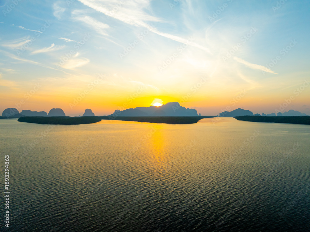 Naklejka premium Aerial view sunset sky,Nature beautiful light Sunset or sunrise over sea,Colorful scenery sunset sky background,Amazing clouds and waves in sunrise sky nature light cloud background