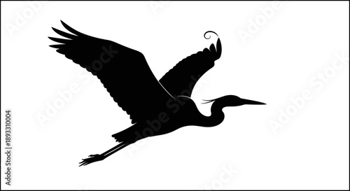 Silhouette of a Great Blue Heron in Flight.