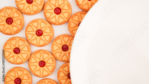 Strawberry jam biscuits on white background