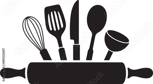 Black kitchen utensils including a whisk, spatula, knife, spoon, and ladle resting on a rolling pin