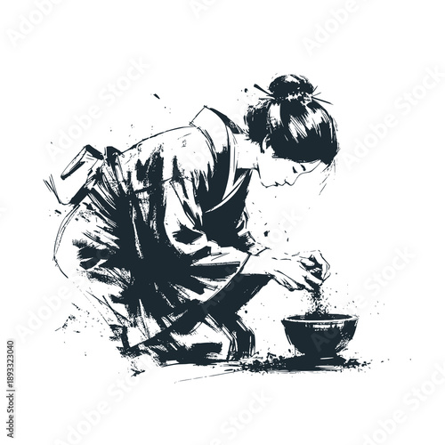 Japanese woman in kimono folding and preparing tea leaves