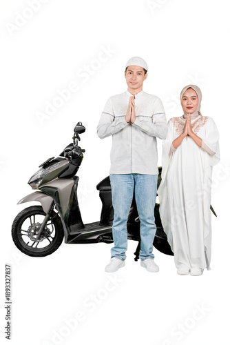 Muslim Couple Giving Greeting Salam Gesture Standing Next to Scooter