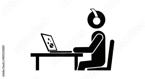 Person wearing headphones working on a laptop computer at a desk.