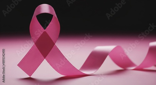 Pink Ribbon Symbol on a Pink and Black Background Surface