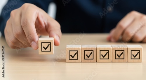 Business hand places final checkmark block, symbolizing task completion and success