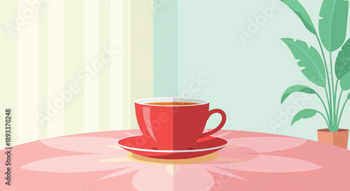A red teacup filled with amber liquid sits on a patterned tablecloth