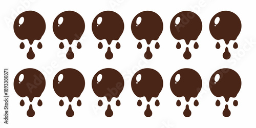 Chocolate drops arranged in neat rows resembling melting forms