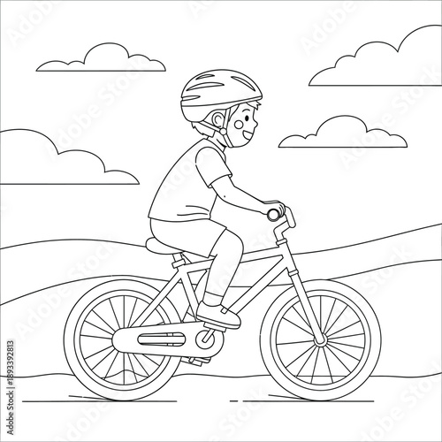 boy riding bicycle with helmet on country road