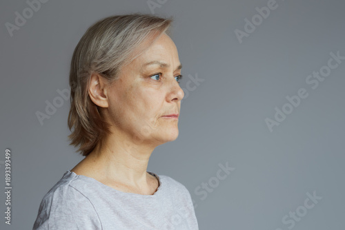 Portrait of a mature woman with a calm confident expression.