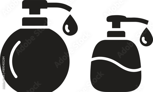 Two pump bottles with liquid droplets falling from their nozzles