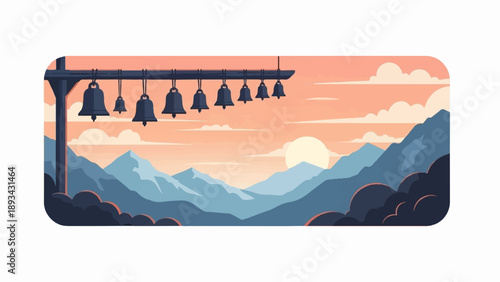 Bells hang from a pole against a mountain vista at sunrise