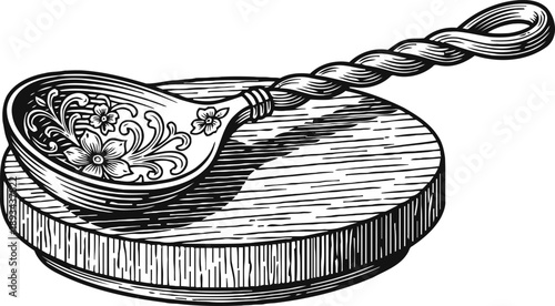 Ornate wooden spoon with floral carvings resting on a round wooden cutting board engraving