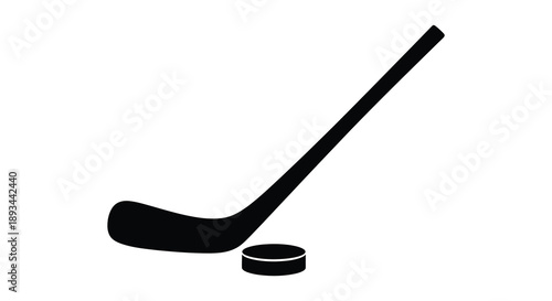 A black hockey stick and puck presented in a striking silhouette