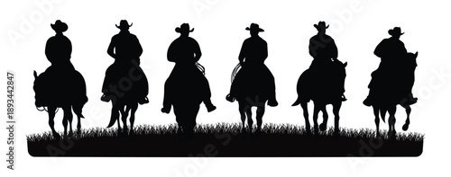  silhouette of some cowboys riding horses in the meadow