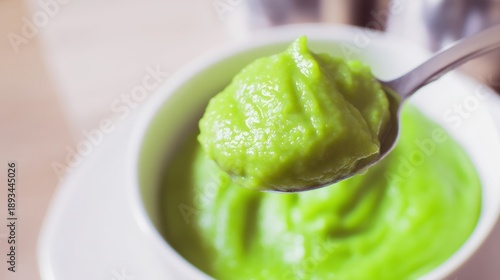Smooth pea flake puree with creamy consistency in a modern kitchen setting. Generative AI