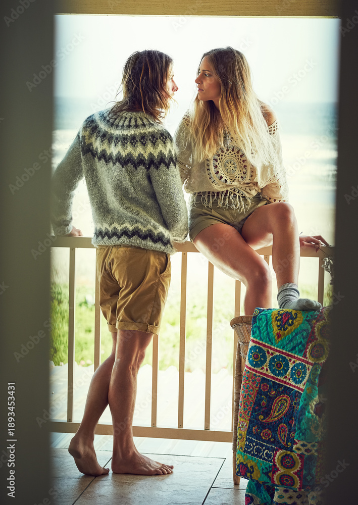 Fototapeta premium Thinking, couple and relax on patio at beach with love, calm morning and reflection on holiday. Thoughts, people or terrace for fresh air, daydreaming and bonding together on ocean at vacation resort