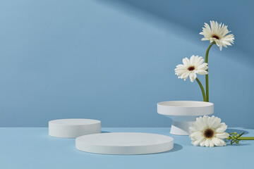 Multiple round white podiums arranged on a pastel blue surface with floral accents, ideal for minimalist product mockups