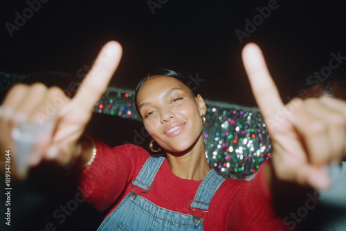 Young woman dancing at party feeling joy and fun