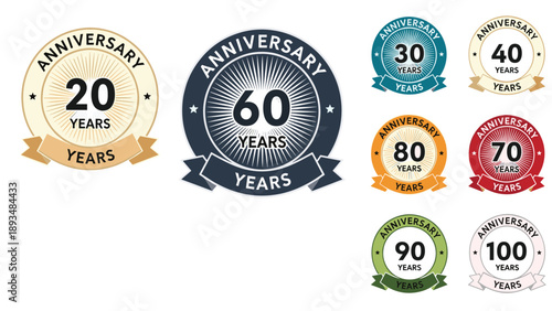 Large collection of anniversary celebration badges ranging from 20 to 100 years with circular designs and colorful banners.