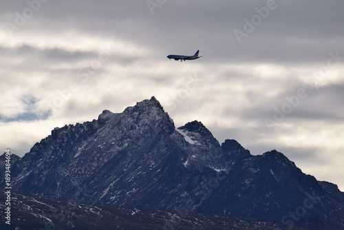 Airplane flying over the mountains