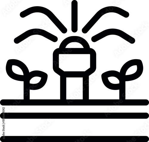 Sprinkler irrigating seedlings growing in cultivated rows of soil