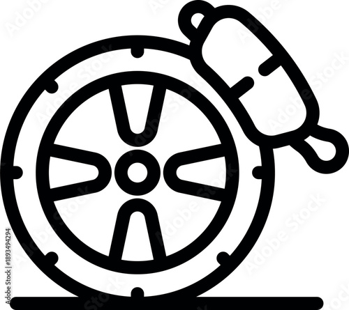 Mechanic changing brake pads on a car wheel during a maintenance service in a garage