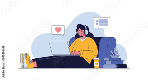 Young woman wearing headphones while working on a laptop on a comfortable blue sofa with heart and comment social media icons.