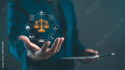 Fotografia A person in a suit holds a tablet, surrounded by legal icons representing justice, law, and various services