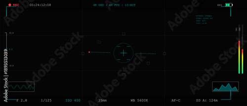 A digital camera interface shows settings like focus point, audio levels, and recording time. The layout includes graphs and indicators, reflecting live recording activity.