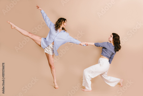Two women dancers together in contemporary dance pose