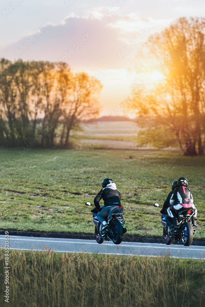 Obraz premium Driver gripping handlebar on open country road