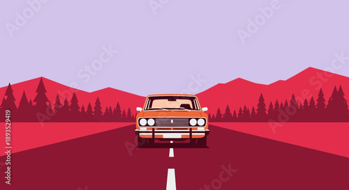 Vintage car driving on a scenic red road through mountains.