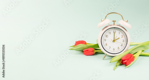 Photography Switch to daylight saving time in spring, summertime changeover, alarm clock wit