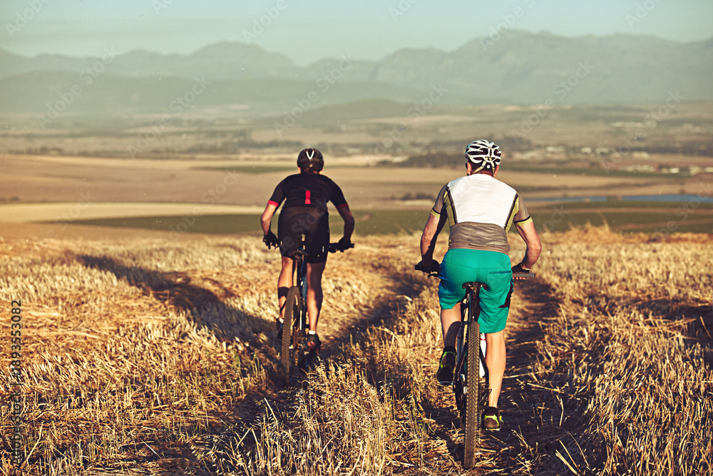 Naklejka premium People, cycling and mountain bike outdoor for adventure, race preparation and endurance training. Back, friends and journey on countryside trail with bicycle, sports workout and exercise for fitness.