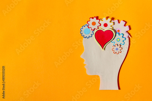 Paper Silhouette of Human Head with Gears and Heart for Mental Health Concept