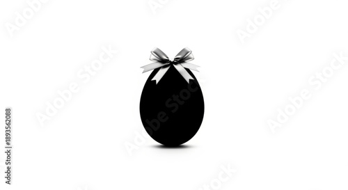 A black egg with a silver bow, isolated on a plain background, viewed from the front.
