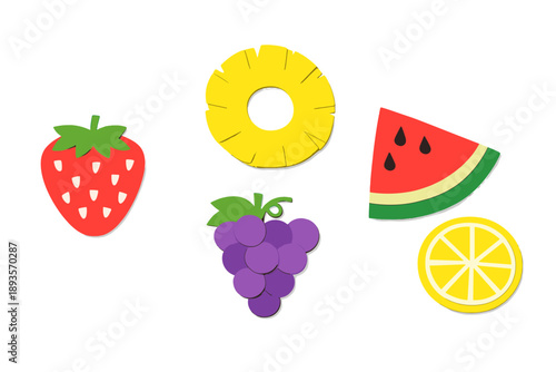 Colorful fruit shapes made of paper arranged on a plain background for a fun and creative craft activity during a warm afternoon