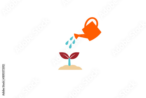 Watering a plant with a watering can in a simple design during daytime hours showing plant growth and care