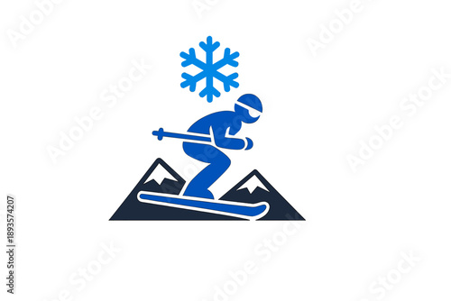 Skiing in the mountains with snow falling and a skier preparing to make a turn on a downhill slope during a winter afternoon