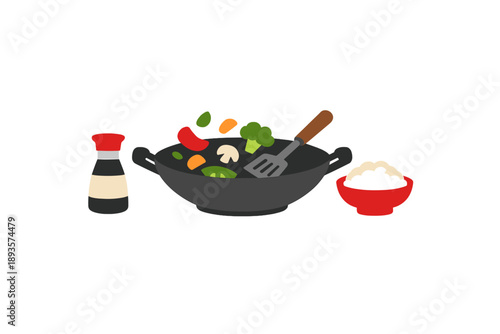 Cooking vegetables in a wok with rice and sauce at home during dinner time