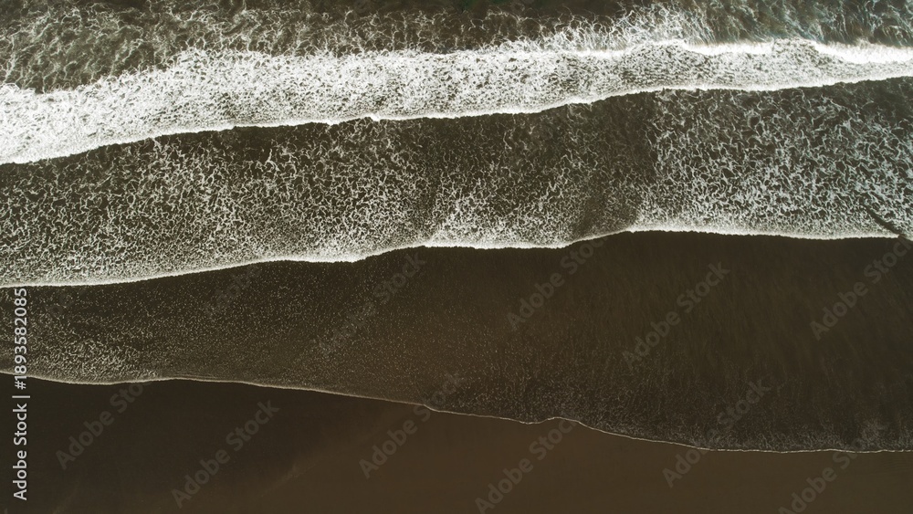 custom made wallpaper toronto digitalAbstract aerial lines of ocean waves on dark sand beach in Costa Rica at overcast dusk.