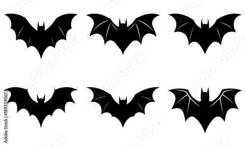 Collection of bat silhouettes in various flight positions and angles