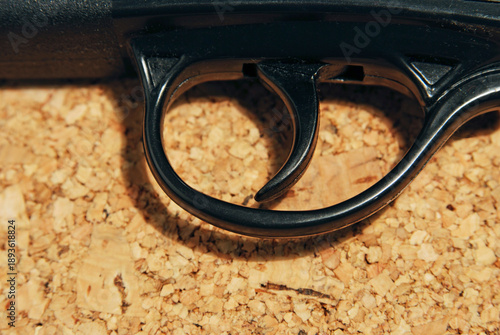 close up of a rifle trigger
