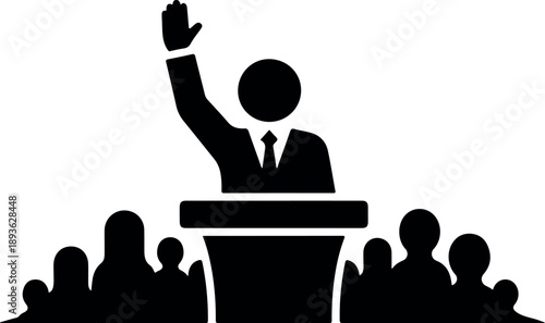 A black and white illustration of a figure standing behind a podium and raising one hand while addressing a seated audience